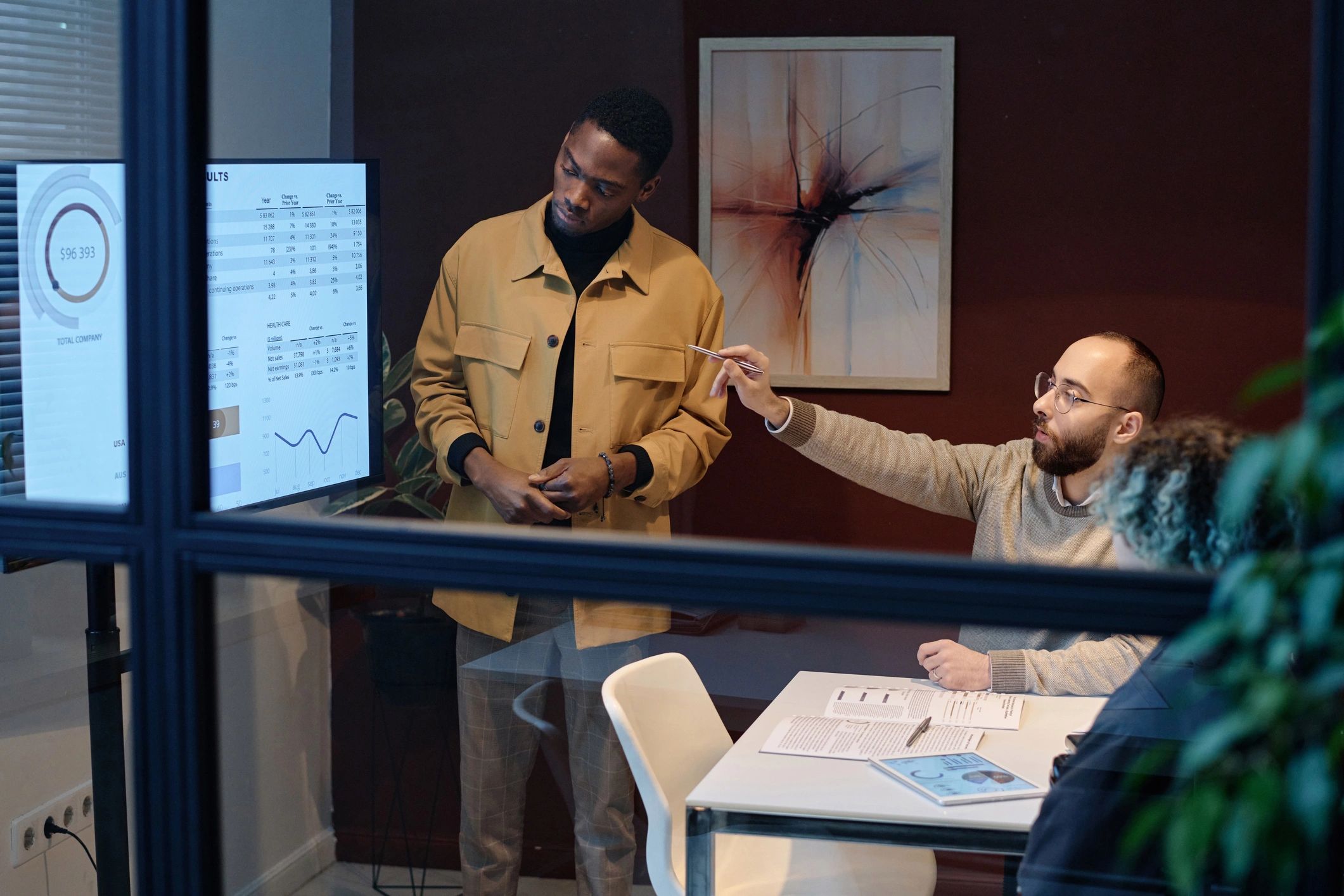 Colleagues analyzing data in a conference room