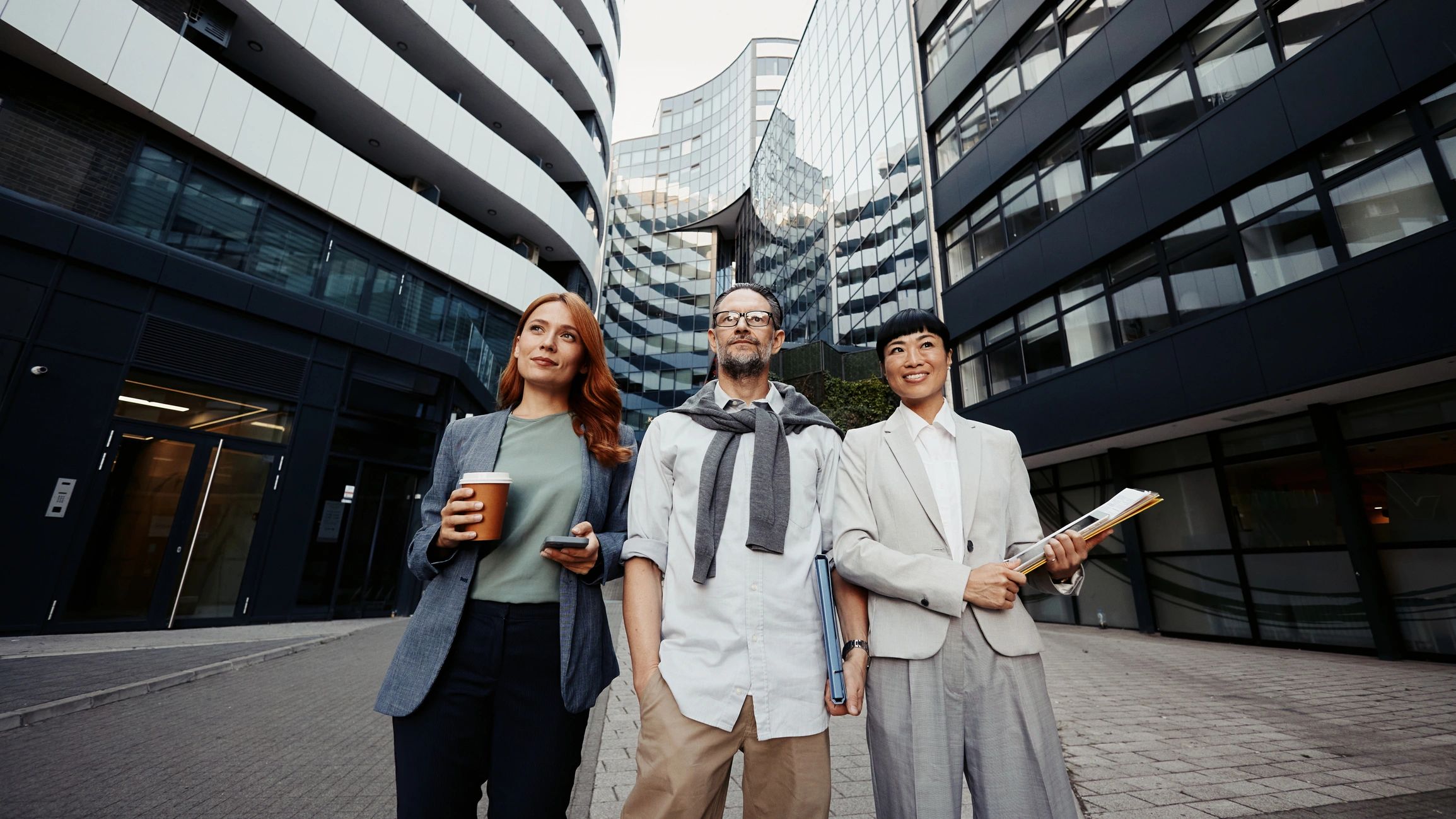 Corporate team discussing a project in an urban setting